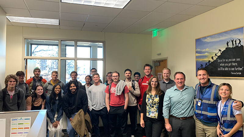 Large group of people pose for photo.