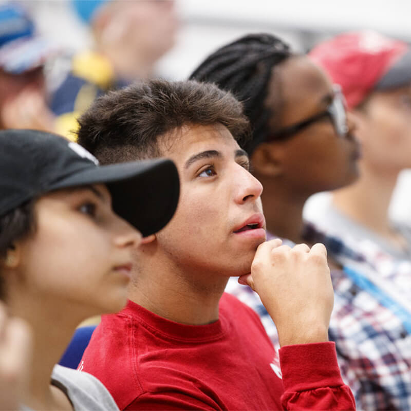 Student in class look up attentively.