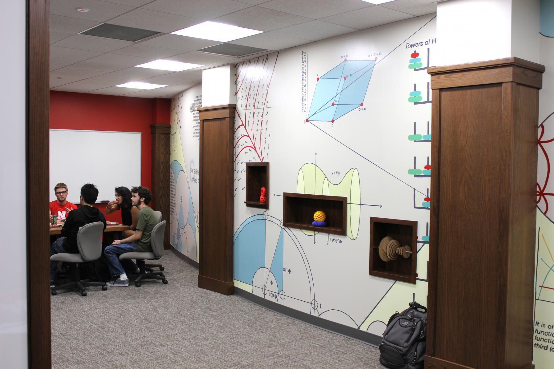 A hand-painted mural fills the entire east wall of the new math lounge in Avery Hall.