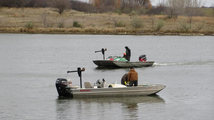 The Nebraska Game and Parks crew applies a chemical called rotenone to Pawnee Reservoir to eradicate white perch and gizzard shad.